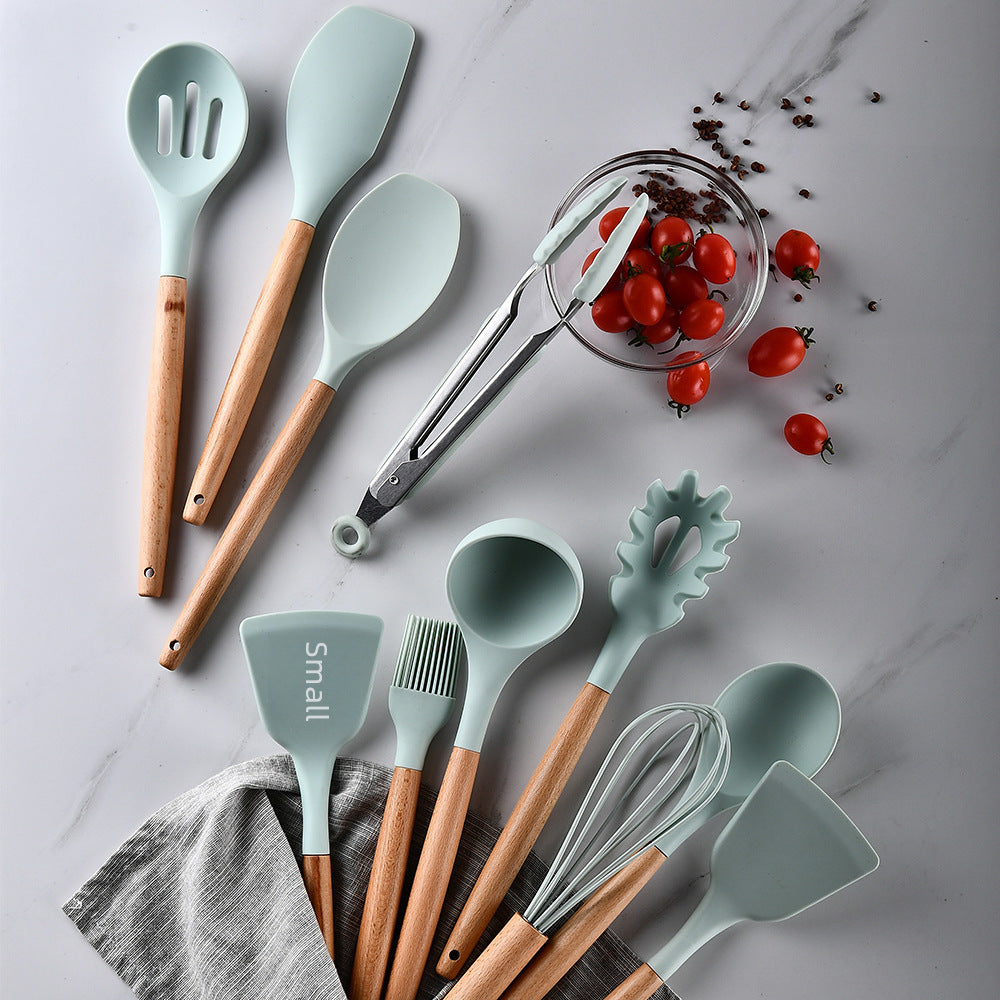 Modern kitchenware set featuring non-stick silicone and ergonomic wooden handles for safe cooking