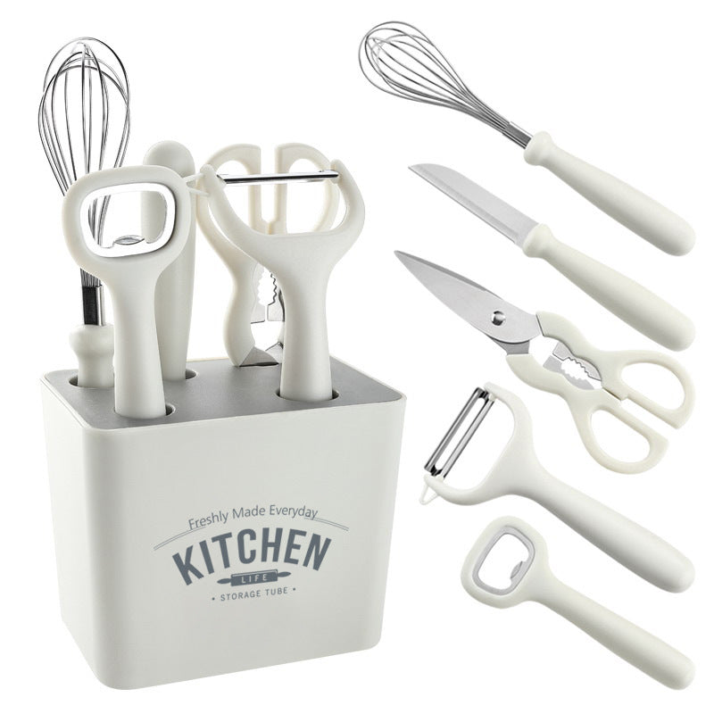 Minimalist white kitchen tool set including whisk, knife, scissors, and peeler with compact storage holder