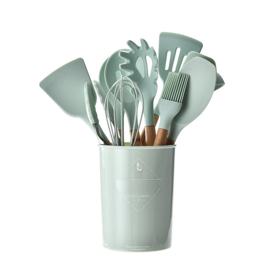 Pastel green silicone kitchen utensil set with wooden handles, perfect for non-stick cookware